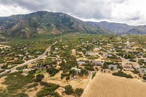 Overview of rural landscape featuring a mountain backdrop