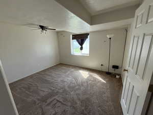 Huge 4th bedroom with a textured ceiling, and ceiling fan