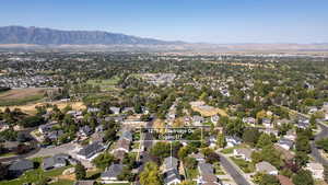 View of property location featuring nearby suburban area and a mountain backdrop