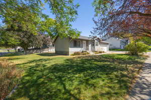 View of front of property featuring driveway and an attached garage