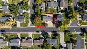 Aerial view of residential area with property boundaries highlighted