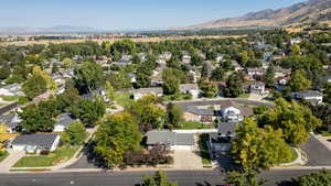 Aerial perspective of suburban area with a mountainous background