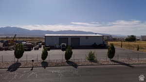View of front of house featuring a mountain view and a garage
