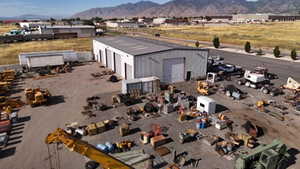 Drone / aerial view of an industrial area and a mountain backdrop