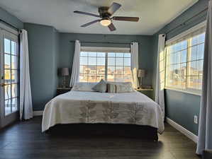 Master bedroom with gorgeous views of the lake and mountains. Just a step away from your private balcony, walk in closet, and luxurious bathroom.