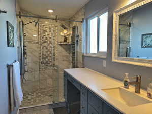 Master bathroom with an extra large vanity and double shower heads.