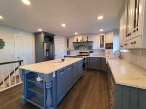Fully updated kitchen with matching appliances, quartz countertops, and lot of space for cooking