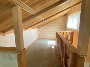 Additional living space with vaulted ceiling, carpet flooring, and wooden ceiling