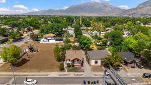 Aerial perspective of suburban area with a mountainous background