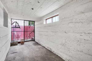 Unfurnished room with concrete floors