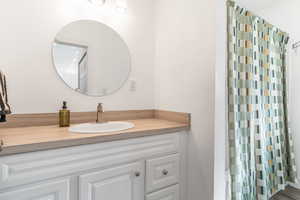 Full bath featuring vanity