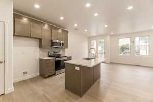 Effortlessly cook and entertain with sleek counters and open space.