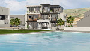 Rear view of property with a balcony and stucco siding