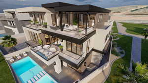 Back of property featuring a balcony, a patio, and stucco siding