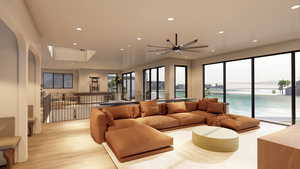 Living area featuring a water view, recessed lighting, and light wood finished floors