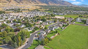 Aerial overview of property's location with nearby suburban area and a mountain backdrop