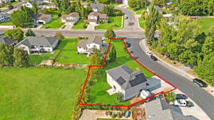 Aerial perspective of suburban area featuring property parcel outlined