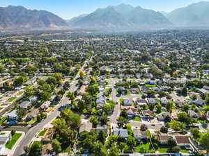 Aerial view of residential area featuring mountains