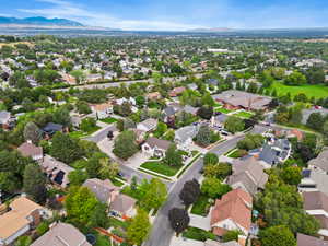 Aerial perspective of suburban area with a mountain backdrop