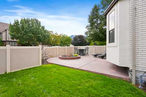Fenced backyard with a patio