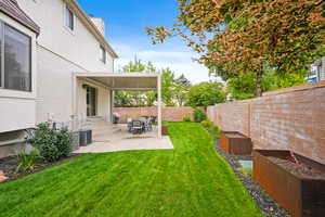 Fenced backyard featuring a patio area