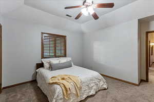 Bedroom with carpet, a textured ceiling, a ceiling fan, and lofted ceiling