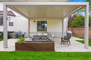 View of patio featuring an outdoor hangout area and area for grilling