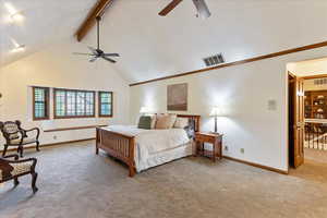 Bedroom featuring high vaulted ceiling, light colored carpet, beamed ceiling, and ceiling fan