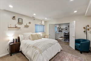 Bedroom with light carpet and recessed lighting