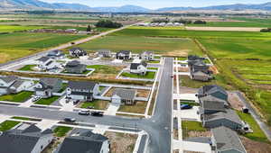 Aerial view of residential area featuring a mountainous background