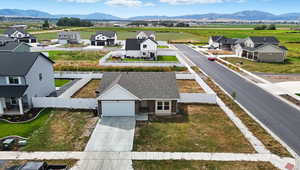 Aerial perspective of suburban area with a mountainous background