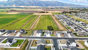 Aerial perspective of suburban area with a mountain backdrop