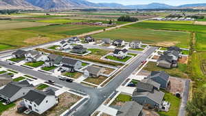 Aerial perspective of suburban area with a mountainous background