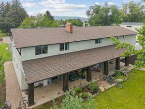 Exterior view of mountains, roof with shingles, and a chimney