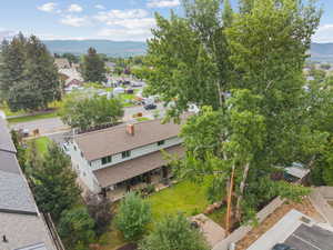 Aerial perspective of suburban area with a mountainous background