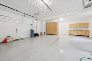 Garage featuring a garage door opener