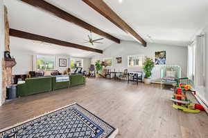 Living area featuring a ceiling fan and wood finished floors