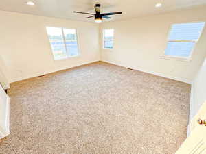 Unfurnished room featuring recessed lighting and light carpet