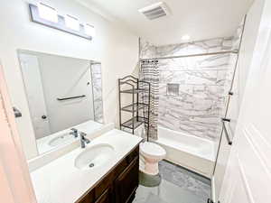 Bathroom with vanity, shower / tub combo with curtain, and recessed lighting