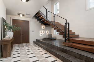 Foyer entrance with inlaid floor details