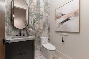 Half bath with vanity and toilet