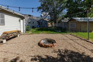 View of yard featuring an outdoor fire pit
