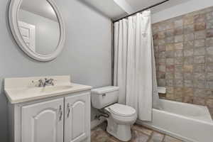 Full bathroom featuring shower / bath combo and vanity