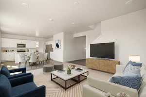 Living room with light wood-style floors and recessed lighting