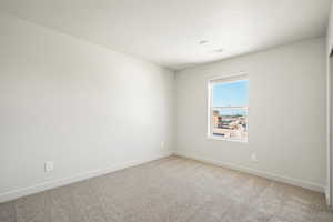 Spare room with carpet floors and a textured ceiling