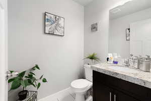Bathroom featuring light tile patterned floors and vanity