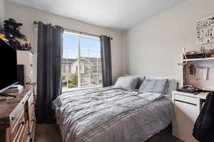 Bedroom featuring dark carpet