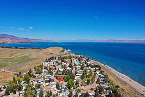 Aerial perspective of suburban area featuring a water and mountain view