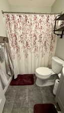 Full bath featuring vanity and curtained shower