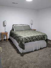 Carpeted bedroom with baseboards